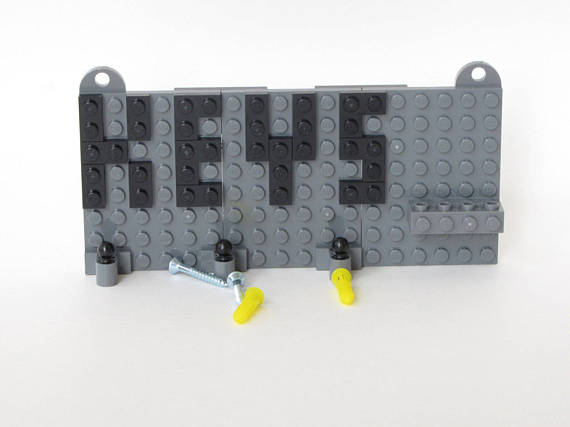 Grey Toy Brick Key Organizer with Black Letters and a Spider-Man Minifigure